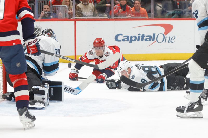 Mar 3, 2026; Washington, District of Columbia, USA; Washington Capitals left wing Pierre-Luc Dubois (80) battles for the puck with Utah Mammoth defenseman Nate Schmidt (88) and Mammoth goalie Karel Vejmelka (70) during the third period at Capital One Arena. Mandatory Credit: Amber Searls-Imagn Images