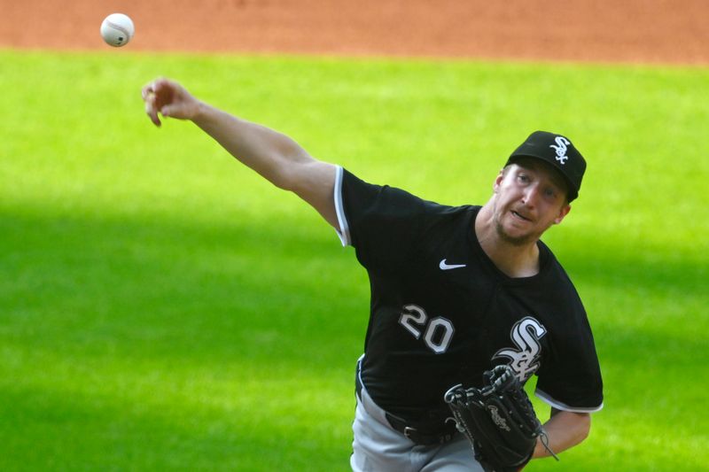 Jul 3, 2024; Cleveland, Ohio, USA; Chicago White Sox starting pitcher Erick Fedde (20) delivers a pitch in the first inning against the Cleveland Guardians at Progressive Field. Mandatory Credit: David Richard-USA TODAY Sports