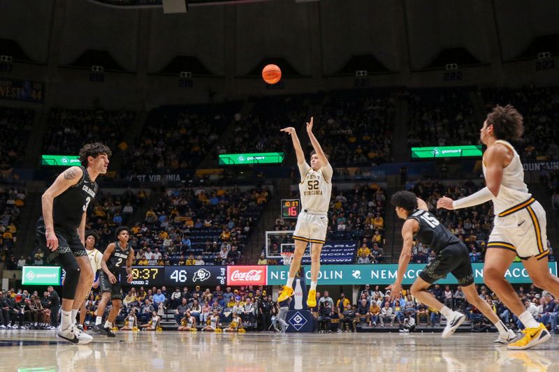 Jan 17, 2026; Morgantown, West Virginia, USA; West Virginia Mountaineers guard Treysen Eaglestaff (52) shoots a three pointer during the second half against the Colorado Buffaloes at Hope Coliseum. Mandatory Credit: Ben Queen-Imagn Images