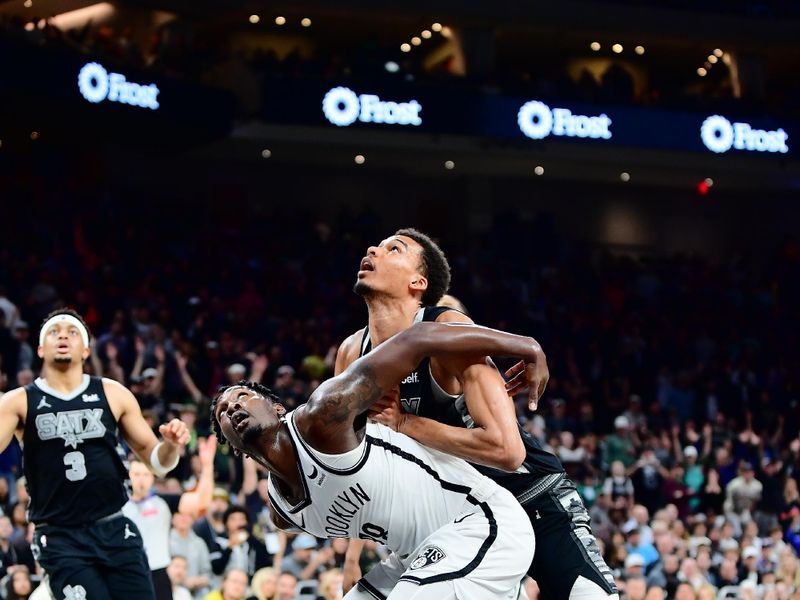 AUSTIN, TX - MARCH 17: Dorian Finney-Smith #28 of the Brooklyn Nets boxes out against Victor Wembanyama #1 of the San Antonio Spurs during overtime of the game on March 17, 2024 at the Moody Center in Austin, Texas. NOTE TO USER: User expressly acknowledges and agrees that, by downloading and or using this photograph, user is consenting to the terms and conditions of the Getty Images License Agreement. Mandatory Copyright Notice: Copyright 2024 NBAE (Photos by Michael Gonzales/NBAE via Getty Images)