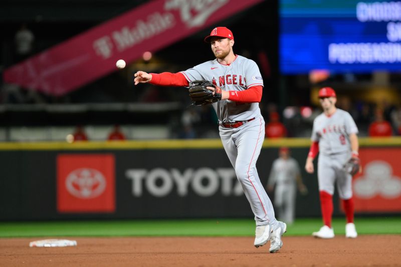 Sep 11, 2023; Seattle, Washington, USA; Los Angeles Angels second baseman Brandon Drury (23) throws to first base during the eighth inning against the Seattle Mariners at T-Mobile Park. Mandatory Credit: Steven Bisig-USA TODAY Sports
