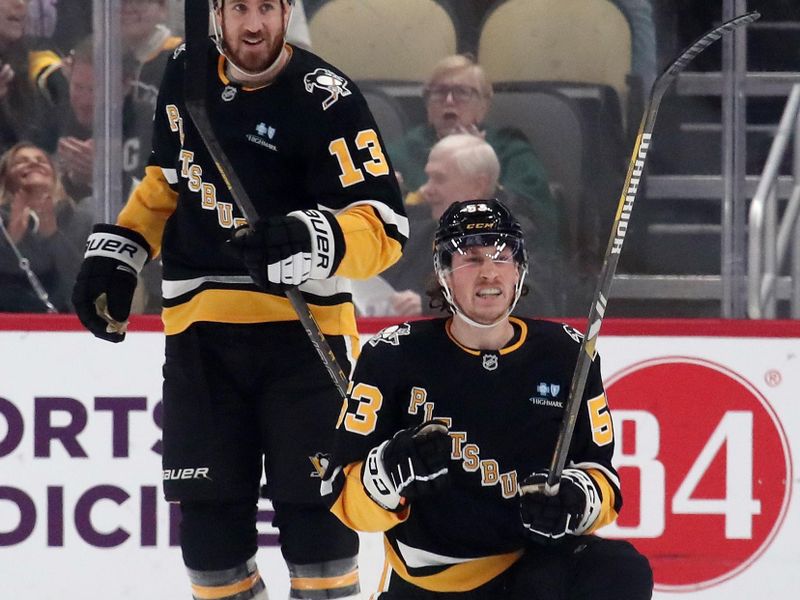 Jan 14, 2025; Pittsburgh, Pennsylvania, USA;  Pittsburgh Penguins center Philip Tomasino (53) celebrates after scoring a goal as right wing Kevin Hayes (13) looks on against the Seattle Kraken during the first period at PPG Paints Arena. Mandatory Credit: Charles LeClaire-Imagn Images