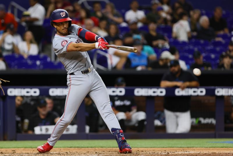 Apr 26, 2024; Miami, Florida, USA; Washington Nationals third baseman Trey Lipscomb (38) hits a single against the Miami Marlins during the eighth inning at loanDepot Park. Mandatory Credit: Sam Navarro-USA TODAY Sports