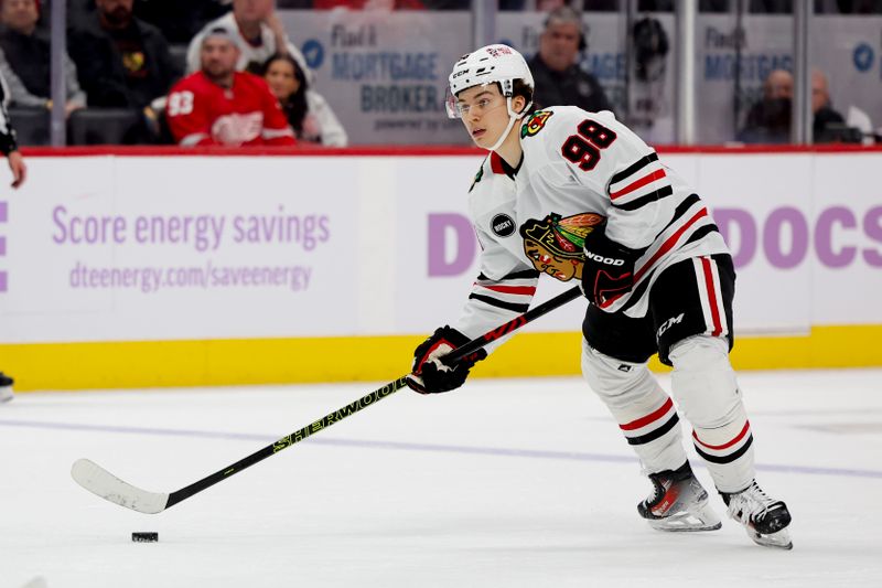 Nov 30, 2023; Detroit, Michigan, USA; Chicago Blackhawks center Connor Bedard (98) skates with the puck in the third period against the Detroit Red Wings at Little Caesars Arena. Mandatory Credit: Rick Osentoski-USA TODAY Sports