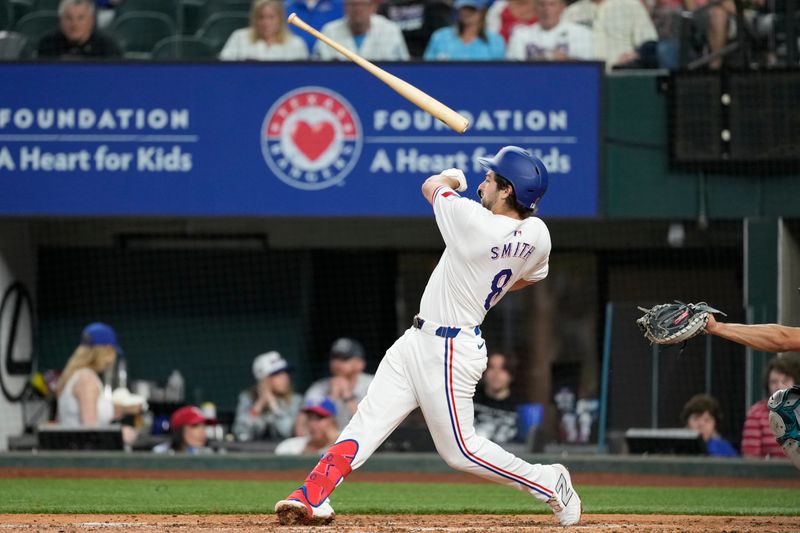 Apr 24, 2024; Arlington, Texas, USA; Texas Rangers third baseman Josh Smith (8) loses his bat on a strike thrown by Seattle Mariners pitcher Bryce Miller (not shown) during the second inning at Globe Life Field. Mandatory Credit: Jim Cowsert-USA TODAY Sports