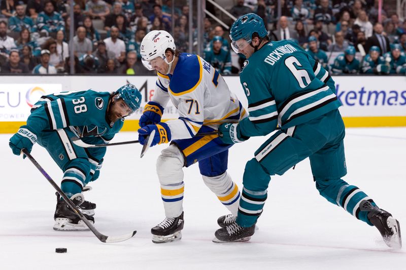 Mar 19, 2026; San Jose, California, USA; Buffalo Sabres center Ryan McLeod (71) tries to split San Jose Sharks defensemen Mario Ferraro (38) and Sam Dickinson (6) during the first period at SAP Center at San Jose. Mandatory Credit: D. Ross Cameron-Imagn Images