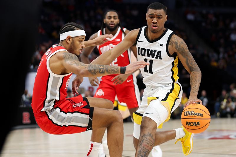 Mar 14, 2024; Minneapolis, MN, USA; Iowa Hawkeyes guard Tony Perkins (11) charges Ohio State Buckeyes guard Roddy Gayle Jr. (1) during the first half at Target Center. Mandatory Credit: Matt Krohn-USA TODAY Sports