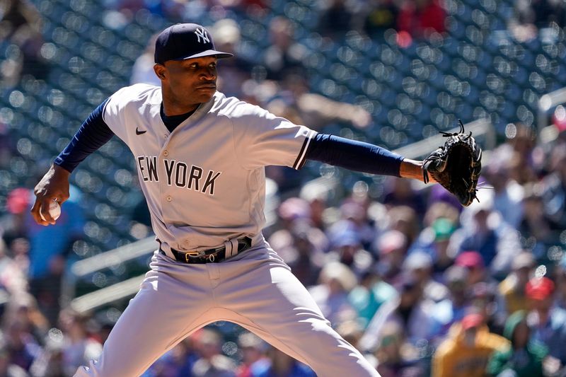 Apr 26, 2023; Minneapolis, Minnesota, USA; New York Yankees pitcher Domingo German (0) delivers a pitch against the Minnesota Twins during the first inning at Target Field. Mandatory Credit: Nick Wosika-USA TODAY Sports

