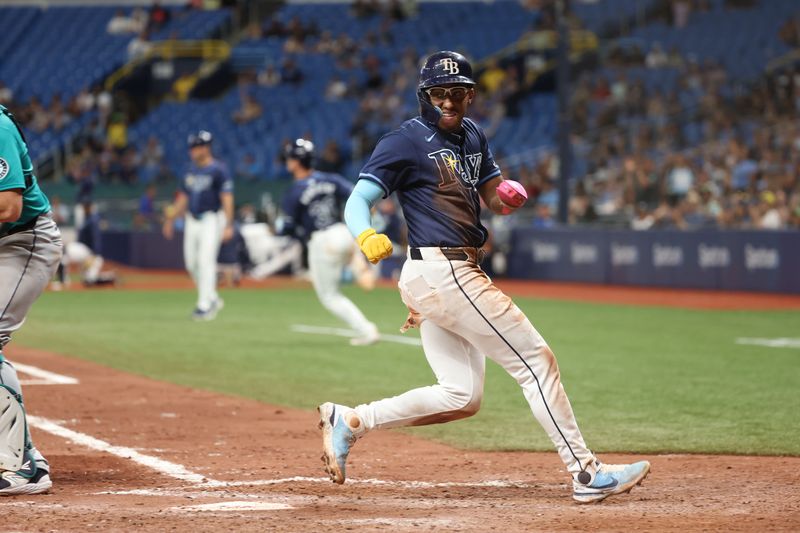 Jun 25, 2024; St. Petersburg, Florida, USA; Tampa Bay Rays outfielder Richie Palacios (1) scores a run against the Seattle Mariners during the eighth inning at Tropicana Field. Mandatory Credit: Kim Klement Neitzel-USA TODAY Sports