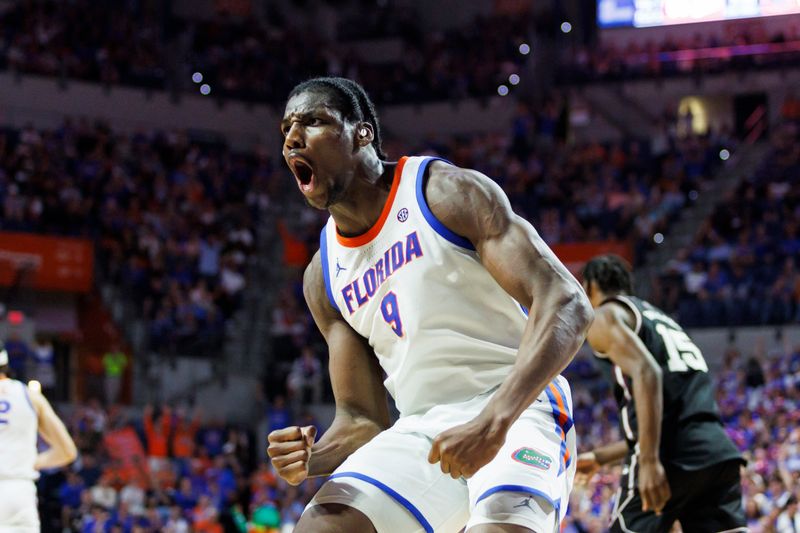 Mar 3, 2026; Gainesville, Florida, USA; Florida Gators center Rueben Chinyelu (9) reacts after a dunk against the Mississippi State Bulldogs during the second half at Exactech Arena at the Stephen C. O'Connell Center. Mandatory Credit: Morgan Tencza-Imagn Images