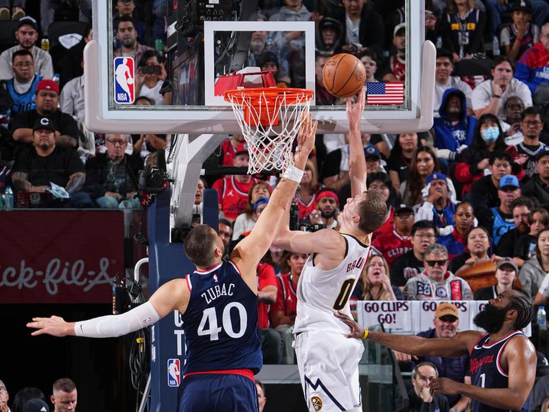 DENVER, CO - APRIL 26: Christian Braun #0 of the Denver Nuggets drives to the basket during the game against the LA Clippers during Round One Game Four of the 2025 NBA Playoffs on April 26, 2025 at Ball Arena in Denver, Colorado. NOTE TO USER: User expressly acknowledges and agrees that, by downloading and/or using this Photograph, user is consenting to the terms and conditions of the Getty Images License Agreement. Mandatory Copyright Notice: Copyright 2025 NBAE (Photo by Garrett Ellwood/NBAE via Getty Images)