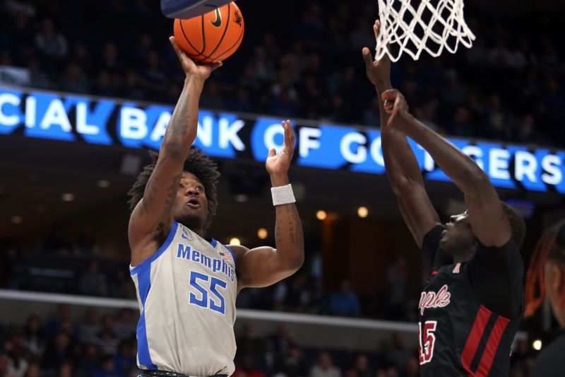 Feb 12, 2023; Memphis, Tennessee, USA; Memphis Tigers guard Damaria Franklin (55) shoots as Temple Owls forward Kur Jongkuch (15) defends during the first half at FedExForum. Mandatory Credit: Petre Thomas-USA TODAY Sports