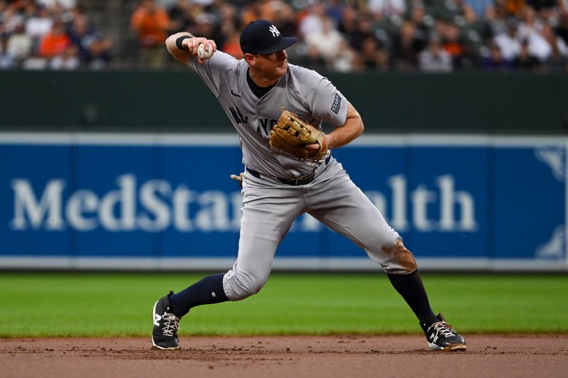 Jul 12, 2024; Baltimore, Maryland, USA; New York Yankees third baseman DJ LeMahieu (26) twos to first base during the first inning against the Baltimore Orioles  at Oriole Park at Camden Yards. Mandatory Credit: Tommy Gilligan-USA TODAY Sports