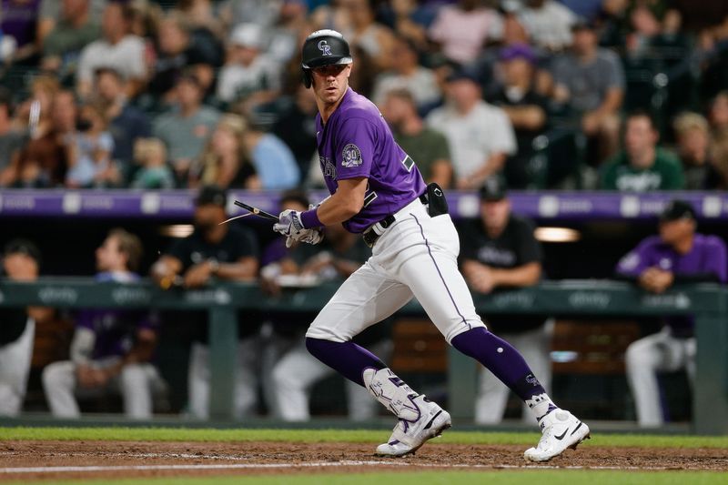 Aug 18, 2023; Denver, Colorado, USA; Colorado Rockies left fielder Nolan Jones (22) looks back at his broken bat on an RBI single in the sixth inning against the Chicago White Sox at Coors Field. Mandatory Credit: Isaiah J. Downing-USA TODAY Sports