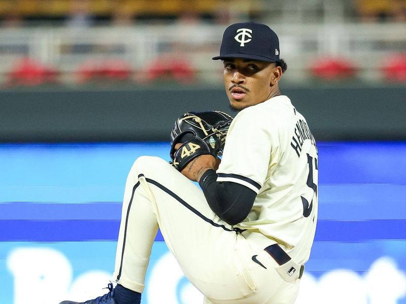 Aug 28, 2024; Minneapolis, Minnesota, USA; Minnesota Twins relief pitcher Ronny Henriquez (31) delivers a pitch against the Atlanta Braves during the ninth inning at Target Field. Mandatory Credit: Matt Krohn-USA TODAY Sports