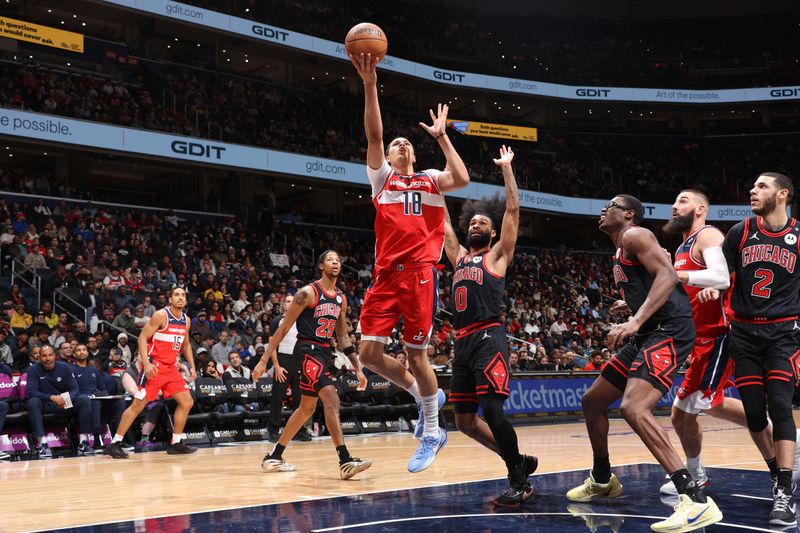 WASHINGTON, DC -? JANUARY 1: Kyshawn George #18 of the Washington Wizards drives to the basket during the game against the Chicago Bulls  on January 1, 2025 at Capital One Arena in Washington, DC. NOTE TO USER: User expressly acknowledges and agrees that, by downloading and or using this Photograph, user is consenting to the terms and conditions of the Getty Images License Agreement. Mandatory Copyright Notice: Copyright 2025 NBAE (Photo by Kenny Giarla/NBAE via Getty Images)
