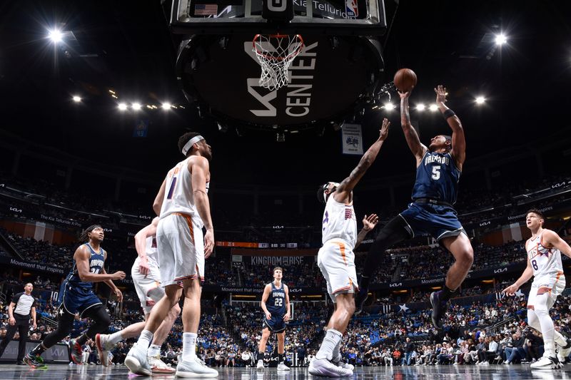 ORLANDO, FL - JANUARY 28: Paolo Banchero #5 of the Orlando Magic goes to the basket during the game on January 28, 2024 at Amway Center in Orlando, Florida. NOTE TO USER: User expressly acknowledges and agrees that, by downloading and or using this photograph, User is consenting to the terms and conditions of the Getty Images License Agreement. Mandatory Copyright Notice: Copyright 2024 NBAE (Photo by Fernando Medina/NBAE via Getty Images)