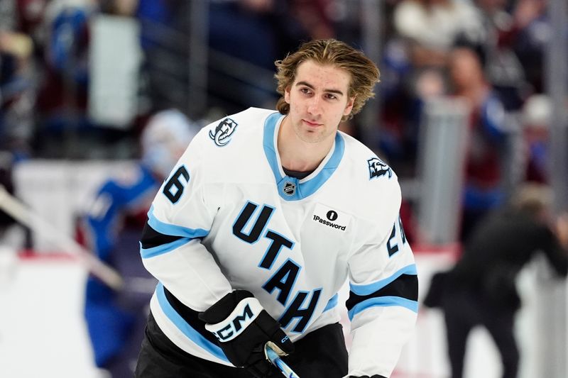 Oct 9, 2025; Denver, Colorado, USA; Utah Mammoth defenseman Dmitri Simashev (26) before the game against the against the Colorado Avalanche at Ball Arena. Mandatory Credit: Ron Chenoy-Imagn Images
