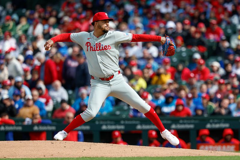 Apr 25, 2025; Chicago, Illinois, USA; Philadelphia Phillies starting pitcher Taijuan Walker (99) delivers a pitch against the Chicago Cubs during the first inning at Wrigley Field. Mandatory Credit: Kamil Krzaczynski-Imagn Images