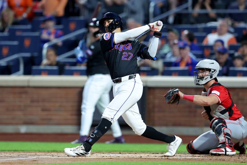 Sep 6, 2024; New York City, New York, USA; New York Mets third baseman Mark Vientos (27) follows through on a two run home run against the Cincinnati Reds during the first inning at Citi Field. Mandatory Credit: Brad Penner-Imagn Images