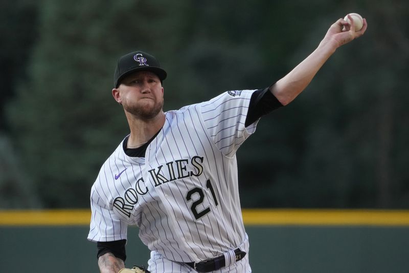 Jul 30, 2022; Denver, Colorado, USA; Colorado Rockies starting pitcher Kyle Freeland (21) delivers a pitch in the first inning against the Los Angeles Dodgers at Coors Field. Mandatory Credit: Ron Chenoy-USA TODAY Sports