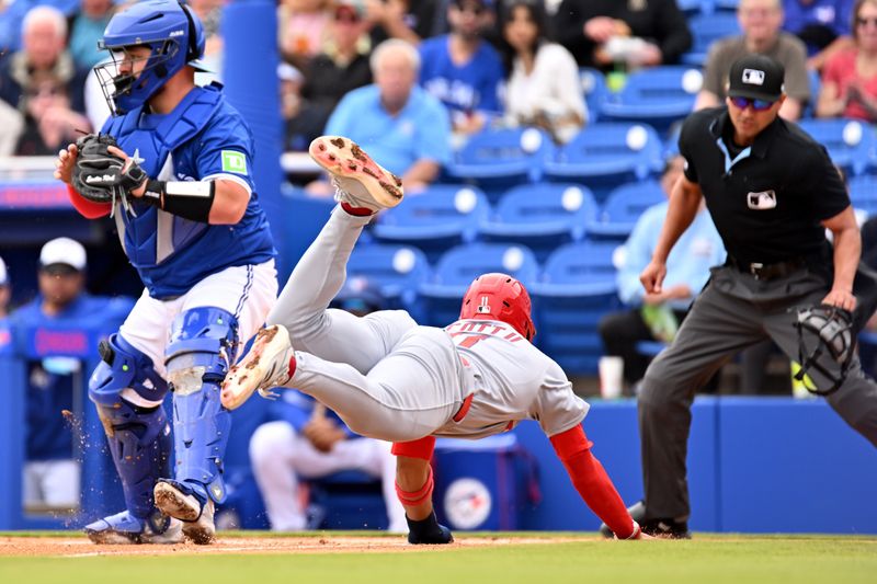 Feb 25, 2025; Dunedin, Florida, USA; St. Louis Cardinals left fielder Victor Scott II (11) scores a run against the Toronto Blue Jays in the first inning of a spring training game at TD Ballpark. Mandatory Credit: Jonathan Dyer-Imagn Images