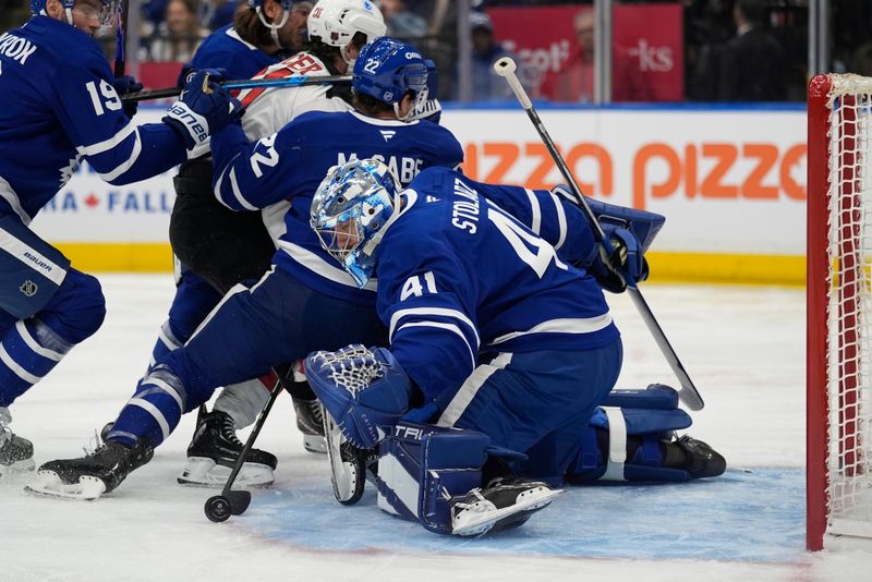 Oct 21, 2025; Toronto, Ontario, CAN; Toronto Maple Leafs goaltender Anthony Stolarz (41) covers up a rebound against the New Jersey Devils during the second period at Scotiabank Arena. Mandatory Credit: John E. Sokolowski-Imagn Images