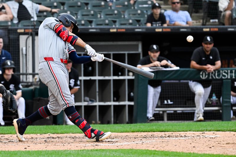 Jul 10, 2024; Chicago, Illinois, USA;  Minnesota Twins third base Brooks Lee (72) hits a home run against the Chicago White Sox during the sixth inning at Guaranteed Rate Field. Mandatory Credit: Matt Marton-USA TODAY Sports