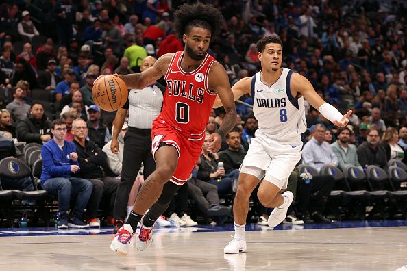 DALLAS, TEXAS - NOVEMBER 01: Coby White #0 of the Chicago Bulls drives to the basket against Josh Green #8 of the Dallas Mavericks of the Dallas Mavericks in the second half at American Airlines Center on November 01, 2023 in Dallas, Texas. NOTE TO USER: User expressly acknowledges and agrees that, by downloading and or using this photograph, User is consenting to the terms and conditions of the Getty Images License Agreement. (Photo by Tim Heitman/Getty Images)