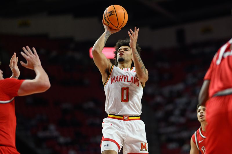 Dec 4, 2024; College Park, Maryland, USA; Maryland Terrapins guard Ja'Kobi Gillespie (0) shoots during the second half against the Ohio State Buckeyes at Xfinity Center. Mandatory Credit: Reggie Hildred-Imagn Images