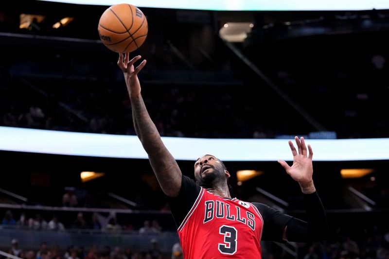 ORLANDO, FLORIDA - APRIL 07: Andre Drummond #3 of the Chicago Bulls attempts to collect a pass against the Orlando Magic during the fourth quarter at Kia Center on April 07, 2024 in Orlando, Florida. NOTE TO USER: User expressly acknowledges and agrees that, by downloading and or using this photograph, User is consenting to the terms and conditions of the Getty Images License Agreement. (Photo by Rich Storry/Getty Images)