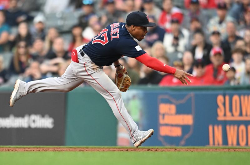 Jun 7, 2023; Cleveland, Ohio, USA; Boston Red Sox second baseman Enmanuel Valdez (47) flips the ball to first base to try and get out Cleveland Guardians third baseman Jose Ramirez (not pictured) during the fourth inning at Progressive Field. Ramirez was safe. Mandatory Credit: Ken Blaze-USA TODAY Sports