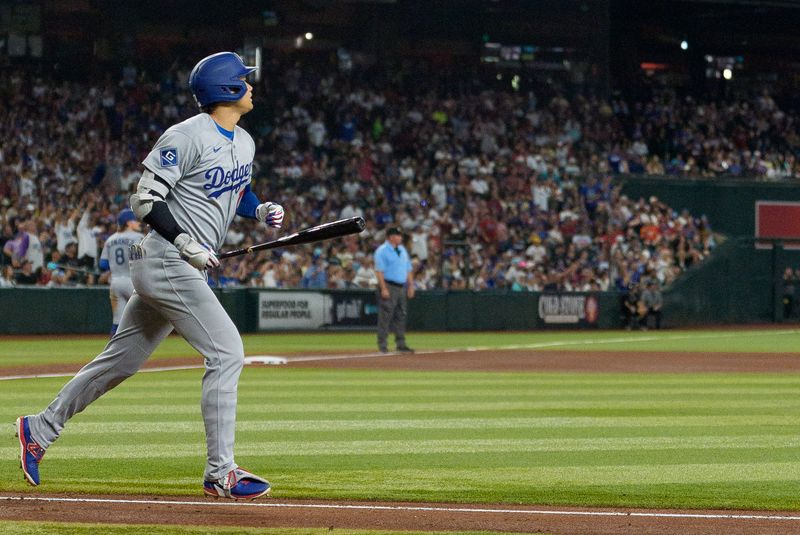 Sep 25, 2025; Phoenix, Arizona, USA; Los Angeles Dodgers designated hitter Shohei Ohtani (17) reacts after hitting a home run in the fourth inning against the Arizona Diamondbacks at Chase Field. Mandatory Credit: Allan Henry-Imagn Images