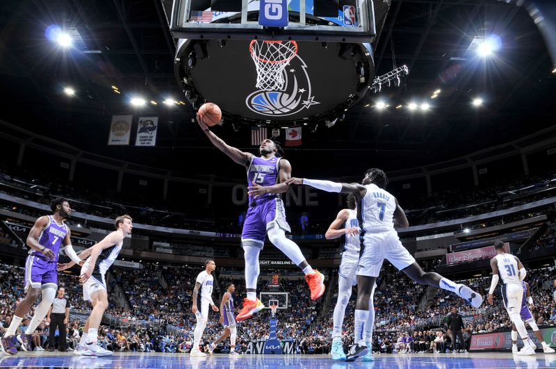 ORLANDO, FL -NOVEMBER 5: Davion Mitchell #15 of the Sacramento Kings drives to the basket against the Orlando Magic on November 5, 2022 at Amway Center in Orlando, Florida. NOTE TO USER: User expressly acknowledges and agrees that, by downloading and or using this photograph, User is consenting to the terms and conditions of the Getty Images License Agreement. Mandatory Copyright Notice: Copyright 2022 NBAE (Photo by Fernando Medina/NBAE via Getty Images)