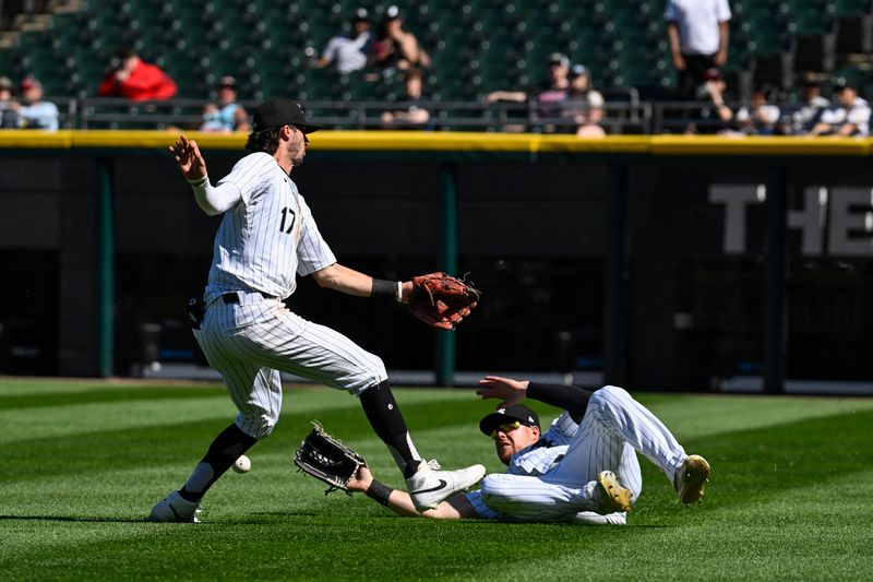 May 1, 2024; Chicago, Illinois, USA; Chicago White Sox shortstop Braden Shewmake (17) and outfielder Gavin Sheets (32) can’t make the play on the ball hit by Minnesota Twins shortstop Willi Castro (50) during the eighth inning at Guaranteed Rate Field. Mandatory Credit: Matt Marton-USA TODAY Sports