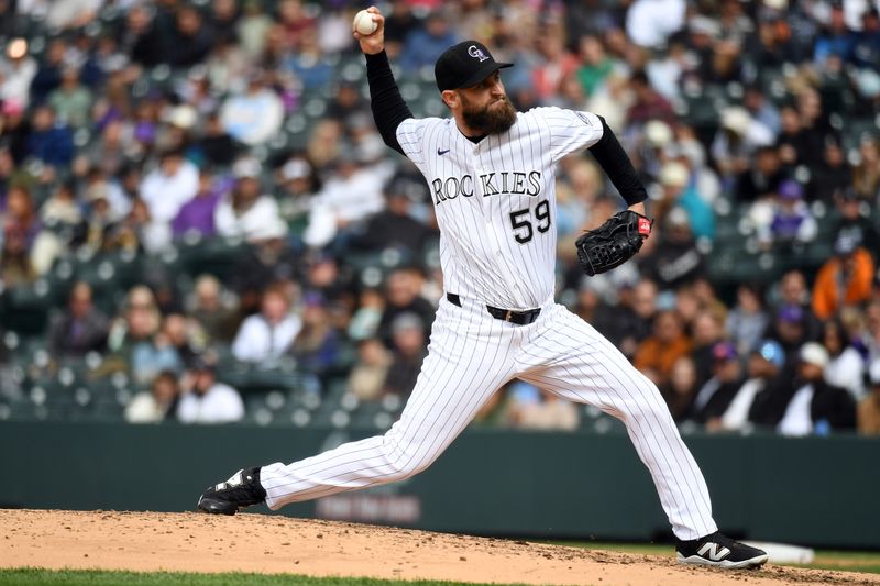Apr 19, 2025; Denver, Colorado, USA; Colorado Rockies pitcher Jake Bird (59) pitches during the sixth inning against the Washington Nationals at Coors Field. Mandatory Credit: Christopher Hanewinckel-Imagn Images