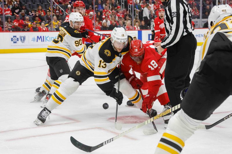 Nov 23, 2024; Detroit, Michigan, USA; Detroit Red Wings center Andrew Copp (18) faces off against Boston Bruins center Charlie Coyle (13) during the second period at Little Caesars Arena. Mandatory Credit: Brian Bradshaw Sevald-Imagn Images