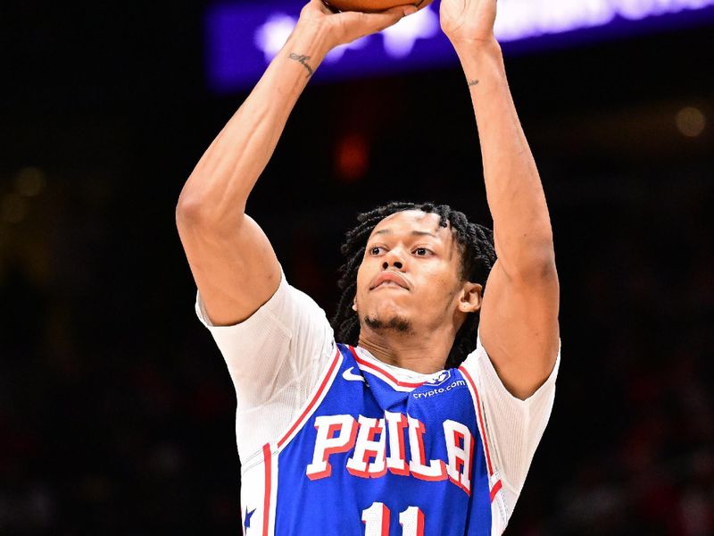 ATLANTA, GA - MARCH 10: Jeff Dowtin Jr. #11 of the Philadelphia 76ers shoots the ball during the game against the Atlanta Hawks on March 10, 2025 at State Farm Arena in Atlanta, Georgia.  NOTE TO USER: User expressly acknowledges and agrees that, by downloading and/or using this Photograph, user is consenting to the terms and conditions of the Getty Images License Agreement. Mandatory Copyright Notice: Copyright 2025 NBAE(Photo by Adam Hagy/NBAE via Getty Images)