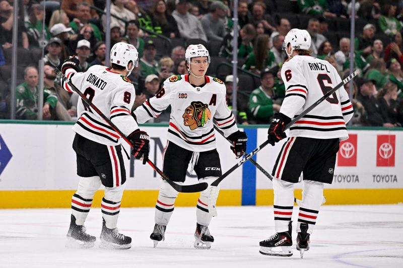 Mar 8, 2026; Dallas, Texas, USA; Chicago Blackhawks defenseman Sam Rinzel (6) and center Ryan Donato (8) celebrate the game tying goal scored by center Connor Bedard (98) against the Dallas Stars during the third period at the American Airlines Center. Mandatory Credit: Jerome Miron-Imagn Images