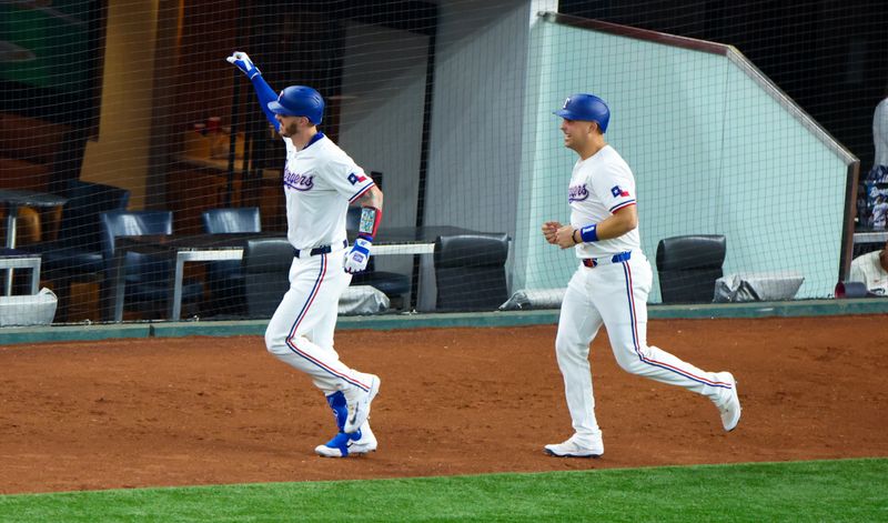 Jun 5, 2024; Arlington, Texas, USA;  Texas Rangers catcher Jonah Heim (28) celebrates with Texas Rangers first base Nathaniel Lowe (30) after hitting a two-run home run during the third inning against the Detroit Tigers at Globe Life Field. Mandatory Credit: Kevin Jairaj-USA TODAY Sports