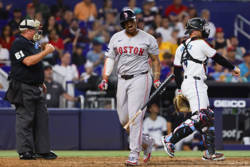 Jul 4, 2024; Miami, Florida, USA; Boston Red Sox third baseman Rafael Devers (11) reacts after striking out against the Miami Marlins during the ninth inning at loanDepot Park. Mandatory Credit: Sam Navarro-USA TODAY Sports