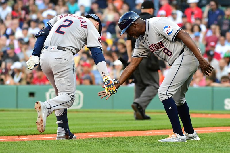 Aug 10, 2024; Boston, Massachusetts, USA;  Houston Astros third baseman Alex Bregman (2) is congratulated by third base coach Gary Pettis (8) after hitting a home run during the seventh inning against the Boston Red Sox at Fenway Park. Mandatory Credit: Bob DeChiara-USA TODAY Sports