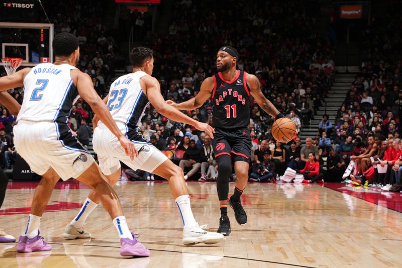 TORONTO, CANADA - JANUARY 3: Bruce Brown #11 of the Toronto Raptors looks on during the game against the Orlando Magic on January 3, 2025 at the Scotiabank Arena in Toronto, Ontario, Canada.  NOTE TO USER: User expressly acknowledges and agrees that, by downloading and or using this Photograph, user is consenting to the terms and conditions of the Getty Images License Agreement.  Mandatory Copyright Notice: Copyright 2025 NBAE(Photo by Mark Blinch/NBAE via Getty Images)