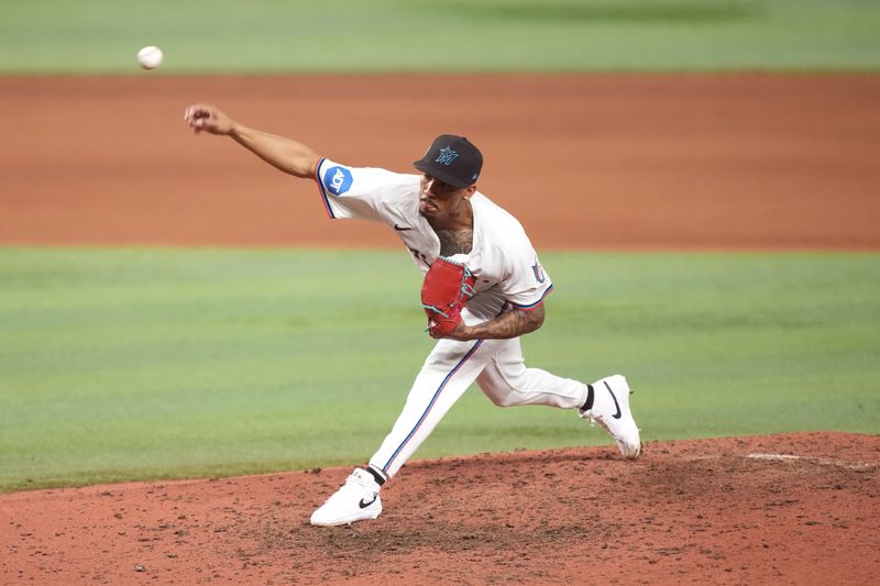 Sep 11, 2025; Miami, Florida, USA;  Miami Marlins relief pitcher Ronny Henriquez (32) pitches in the eighth inning against the Washington Nationals at loanDepot Park. Mandatory Credit: Jim Rassol-Imagn Images