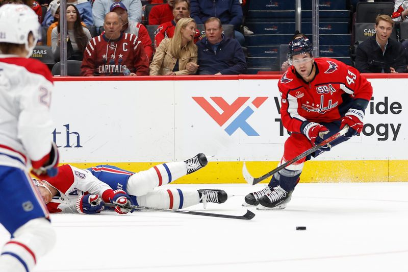 Oct 31, 2024; Washington, District of Columbia, USA; Washington Capitals right wing Tom Wilson (43) skates with the puck past Montreal Canadiens defenseman Mike Matheson (8) in the first period at Capital One Arena. Mandatory Credit: Geoff Burke-Imagn Images