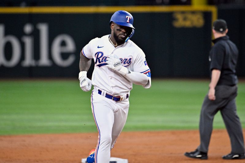 Oct 10, 2023; Arlington, Texas, USA; Texas Rangers right fielder Adolis Garcia (53) runs after hitting a three run home run against the Baltimore Orioles in the second inning during game three of the ALDS for the 2023 MLB playoffs at Globe Life Field. Mandatory Credit: Jerome Miron-USA TODAY Sports