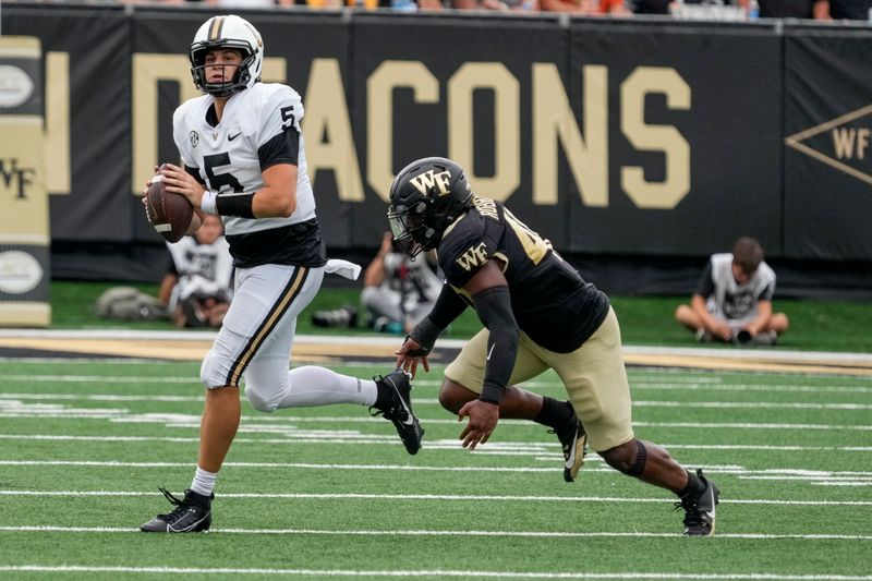 Sep 9, 2023; Winston-Salem, North Carolina, USA; Vanderbilt Commodores quarterback AJ Swann (5) is chased by Wake Forest Demon Deacons linebacker Jacob Roberts (40) during the second half at Allegacy Federal Credit Union Stadium. Mandatory Credit: Jim Dedmon-USA TODAY Sports