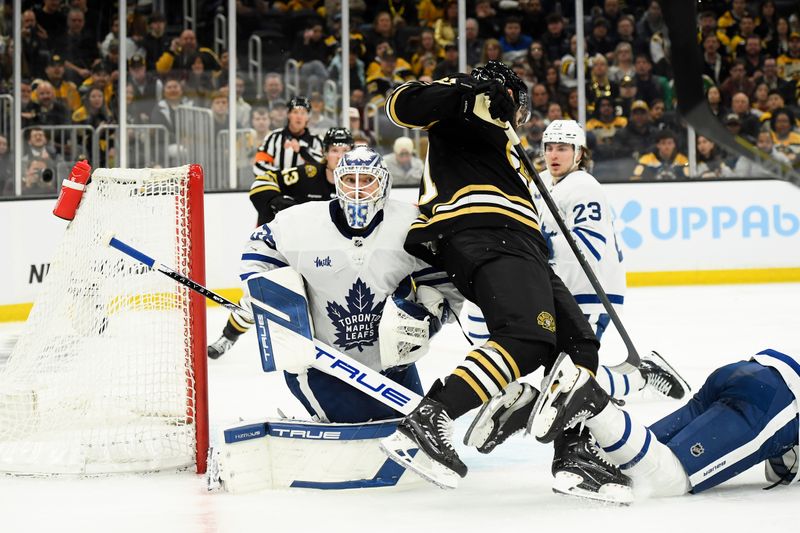 Apr 20, 2024; Boston, Massachusetts, USA; Boston Bruins left wing Pat Maroon (61) falls into Toronto Maple Leafs goaltender Ilya Samsonov (35) during the third period in game one of the first round of the 2024 Stanley Cup Playoffs at TD Garden. Mandatory Credit: Bob DeChiara-USA TODAY Sports