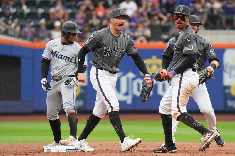 Aug 17, 2024; New York City, New York, USA; New York Mets third baseman Mark Vientos (27) celebrates with New York Mets left fielder Brandon Nimmo (9) and New York Mets center fielder Harrison Bader (44)  after tagging out Miami Marlins shortstop Xavier Edwards (63) for a double play during the 3rd inning at Citi Field. Mandatory Credit: Lucas Boland-USA TODAY Sports