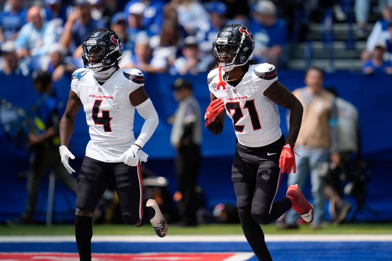 Houston Texans safety Calen Bullock (21) celebrates after intercepting a pass during the first half of an NFL football game against the Indianapolis Colts, Sunday, Sept. 8, 2024, in Indianapolis. (AP Photo/Michael Conroy)